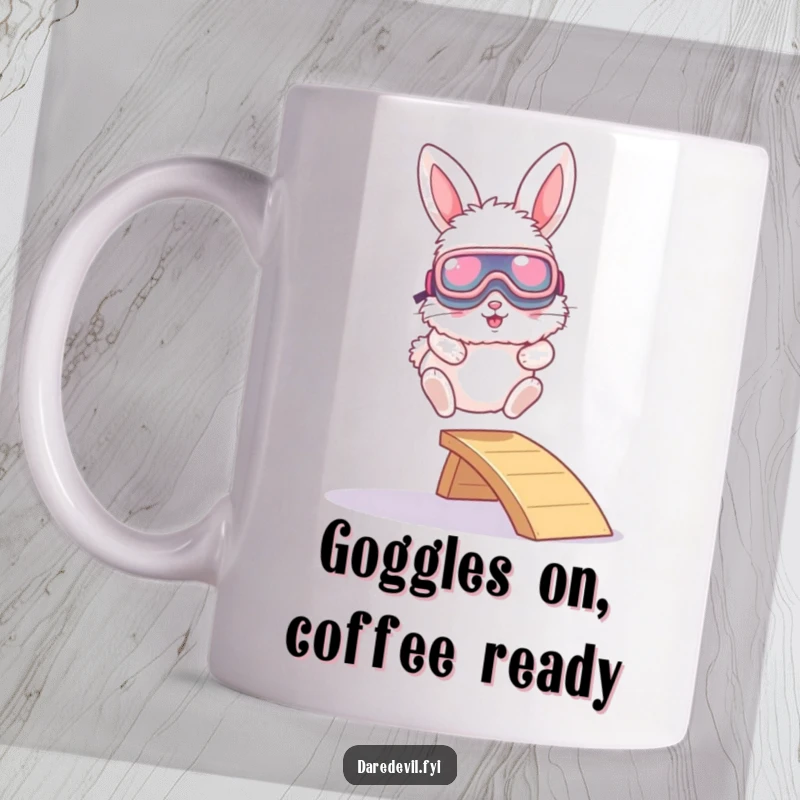 Funny mug with a fluffy bunny wearing oversized goggles, joyfully leaping off a tiny ramp with pure excitement and a sense of adventure.