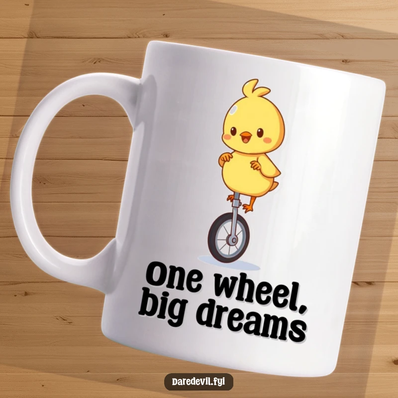 Funny mug featuring a playful chick character attempting to balance on a unicycle with a determined, comical expression.