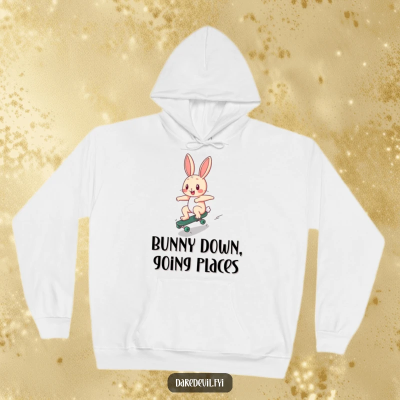 Funny Hoodie: A happy bunny character zooms down a ramp on a tiny skateboard, offering warmth and humorous skater style.