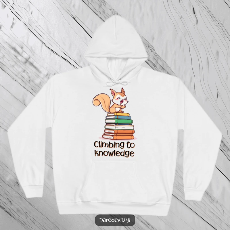 Funny hoodie design of a giggling squirrel character rapidly scaling a precarious stack of books, embodying a humorous love for reading.