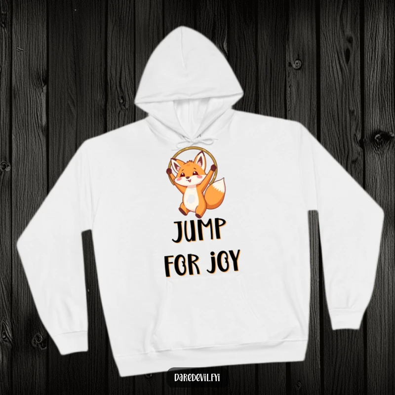 Funny fox jumping through a hoop, depicted on a soft, warm hoodie, ideal for cozy, adventurous wear.