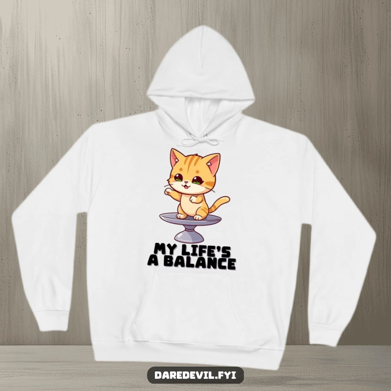 Funny cat hoodie showing a mischievous cat character skillfully balancing on a spinning plate, looking focused.