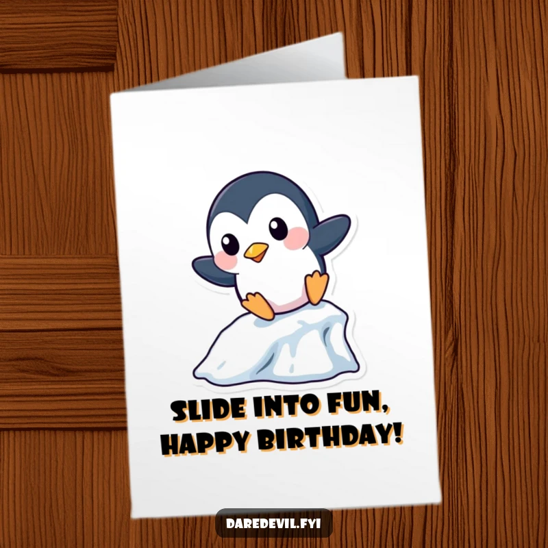 Funny Free Printable Birthday Card: A playful penguin boldly slides down a miniature icicle, bringing icy excitement to birthday wishes.