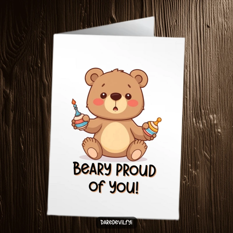 Free Printable Congratulations Card: Bear cub attempting to juggle, representing a successful, albeit clumsy, achievement.