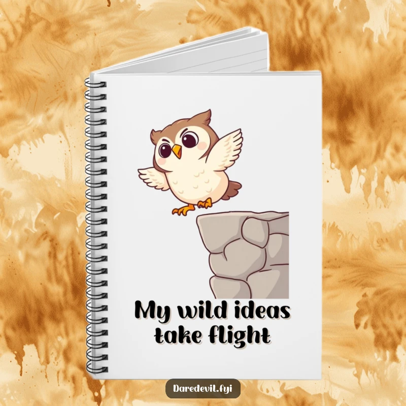 Funny notebook with a blank page and a giggling owl character performing a funny dive on the cover, ready for ideas.