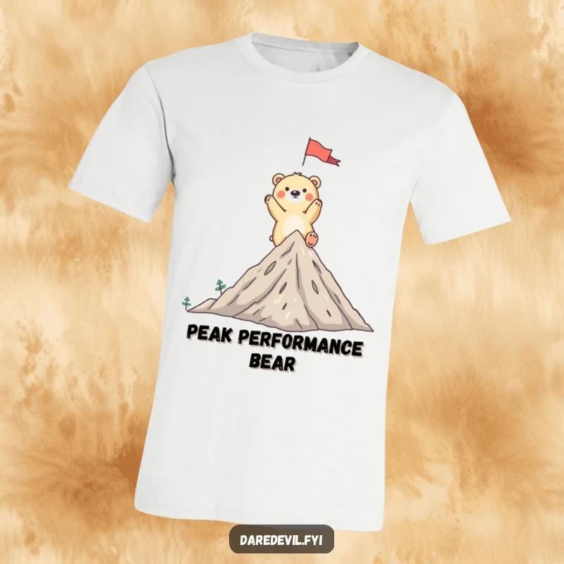 Funny bear t-shirt of a whimsical bear triumphantly planting a flag on a tiny mountain peak, embodying accomplishment.