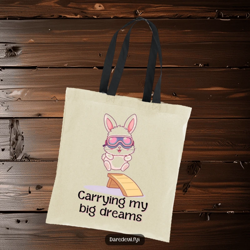 Funny tote bag depicting a fluffy bunny in oversized goggles launching off a miniature ramp, ready for any journey.
